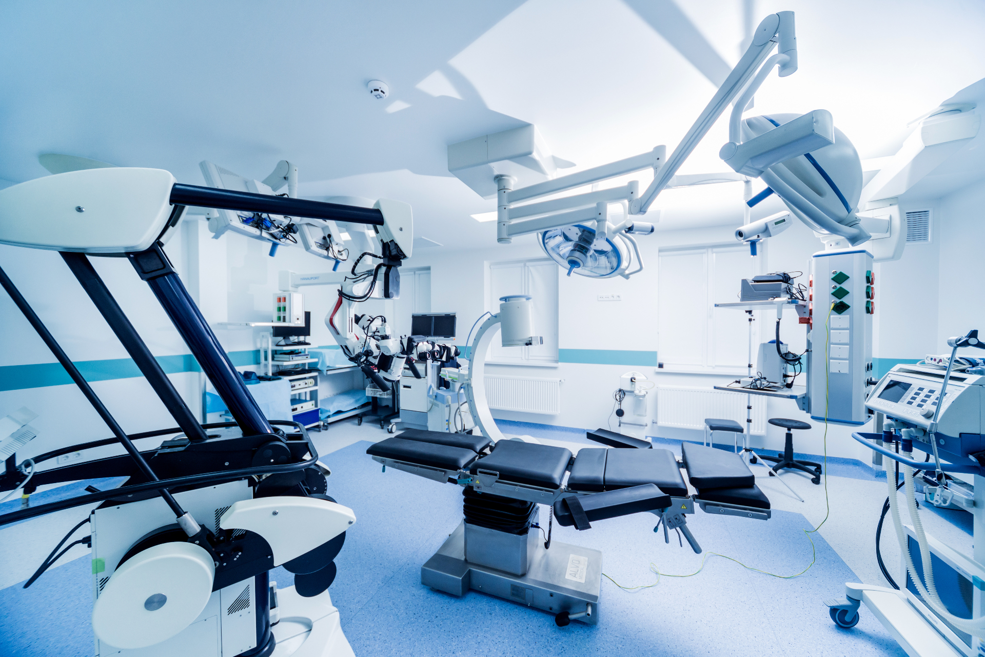 Modern surgical suite showing the environment where minimally invasive systems are deployed