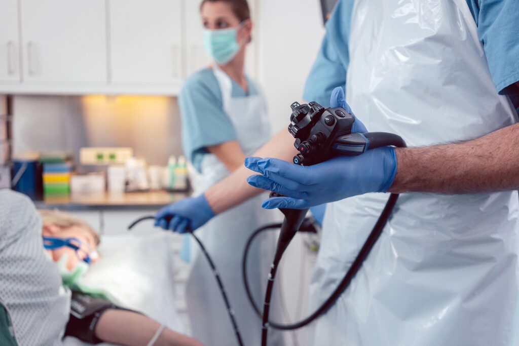 Close-up of an endoscope being used in a clinical setting
