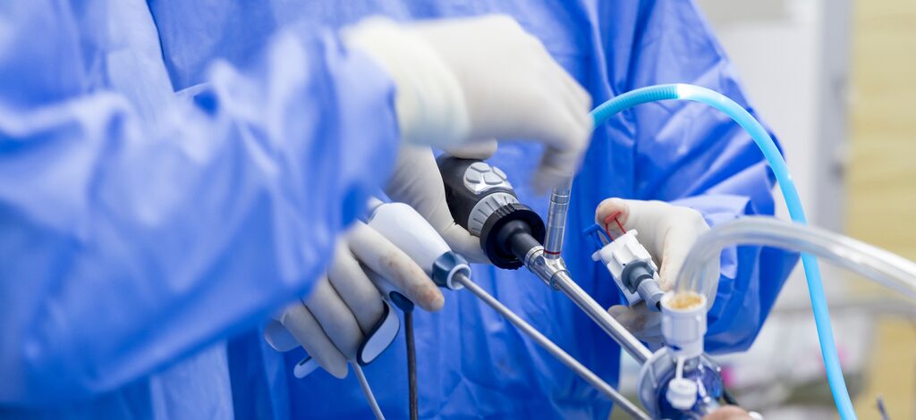 Laparoscopic instruments in active use during a minimally invasive procedure